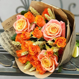 Bouquet of spray roses with wheat