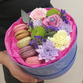 Box with sweets and flowers