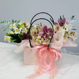 Orchids and alstroemerias in a bag