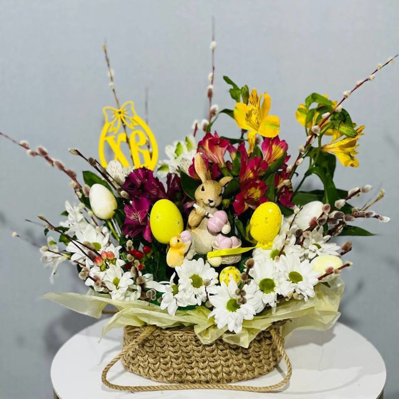 Easter gift composition with fresh flowers and willow branches, standart