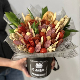 Edible bouquet of sausages and snacks