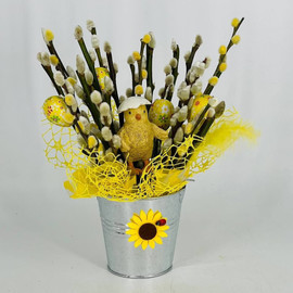 A bouquet of natural willow in a tin bucket with a chicken