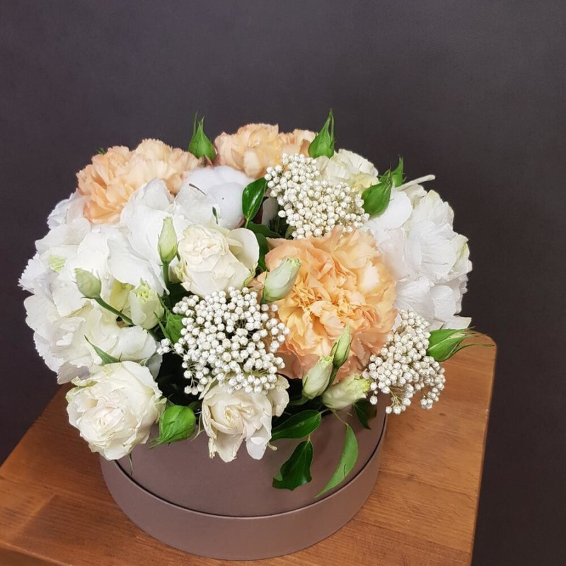 Flowers in a box. White eustoma and hydrangea, peach dianthus, standart