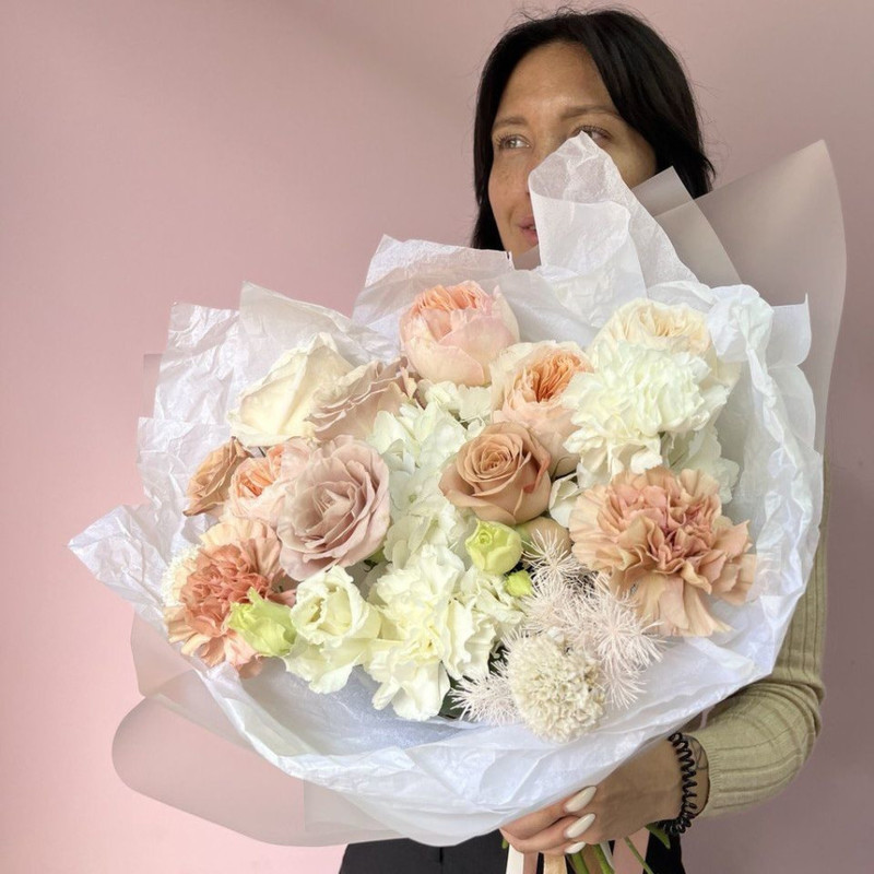 Bouquet of a mix of elite peony roses on a hydrangea pillow, standart