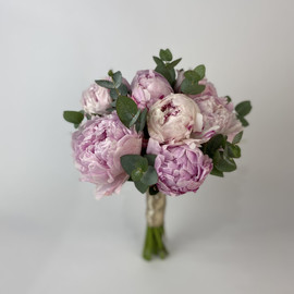 Wedding bouquet and boutonniere with peonies and eucalyptus