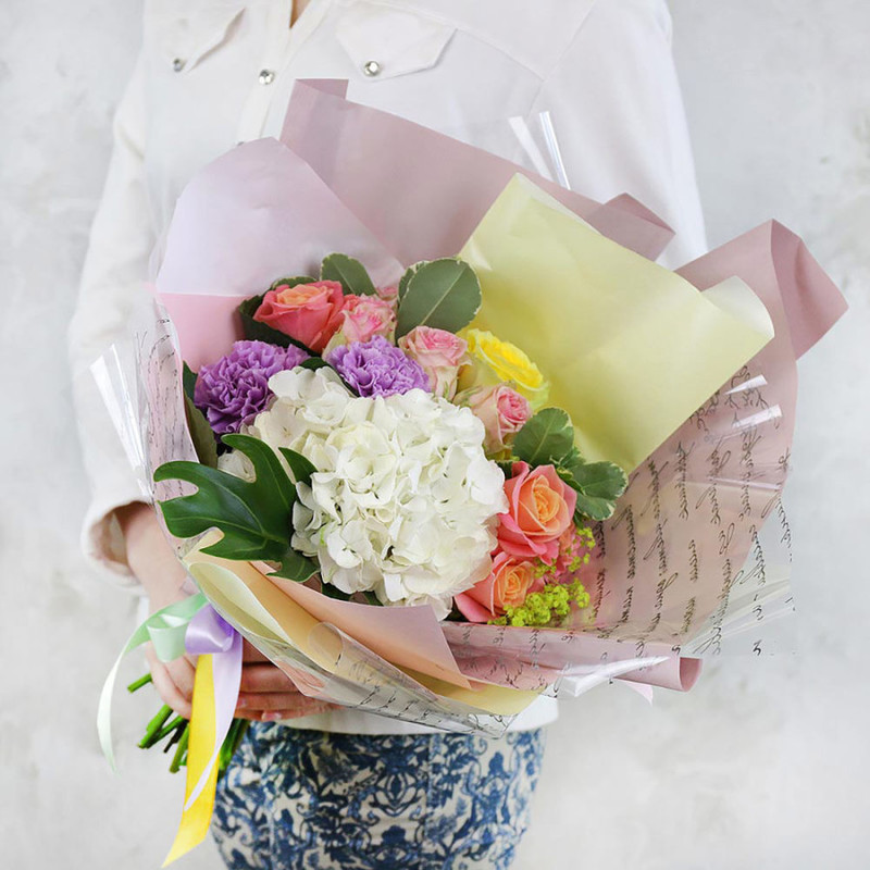 Summer bouquet of hydrangeas, carnations and alchemilla in the original packaging, standart