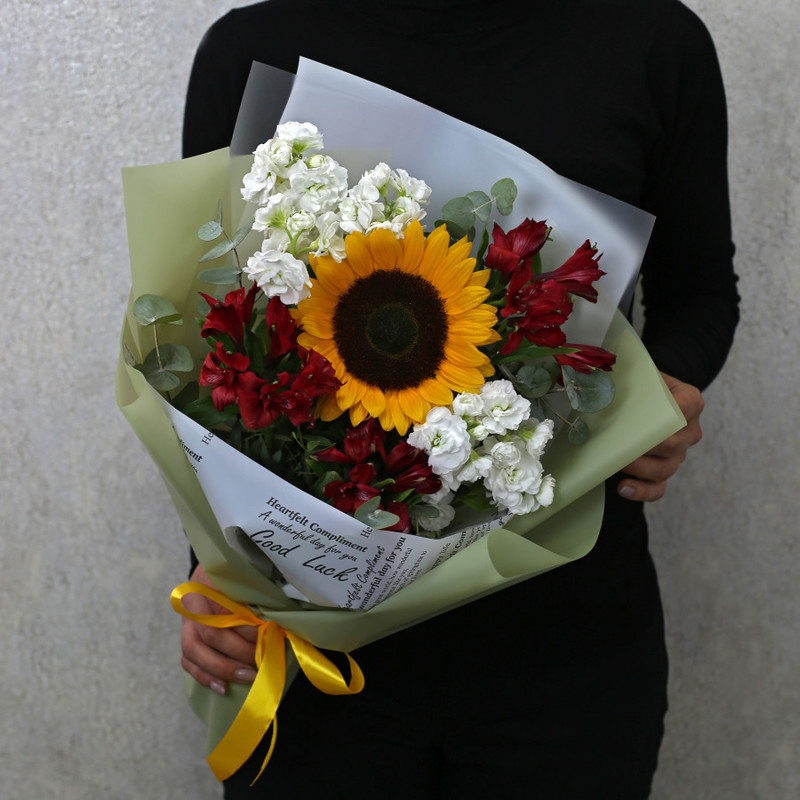 Bouquet of sunflower, white matthiola and red alstroemeria in designer packaging, standart