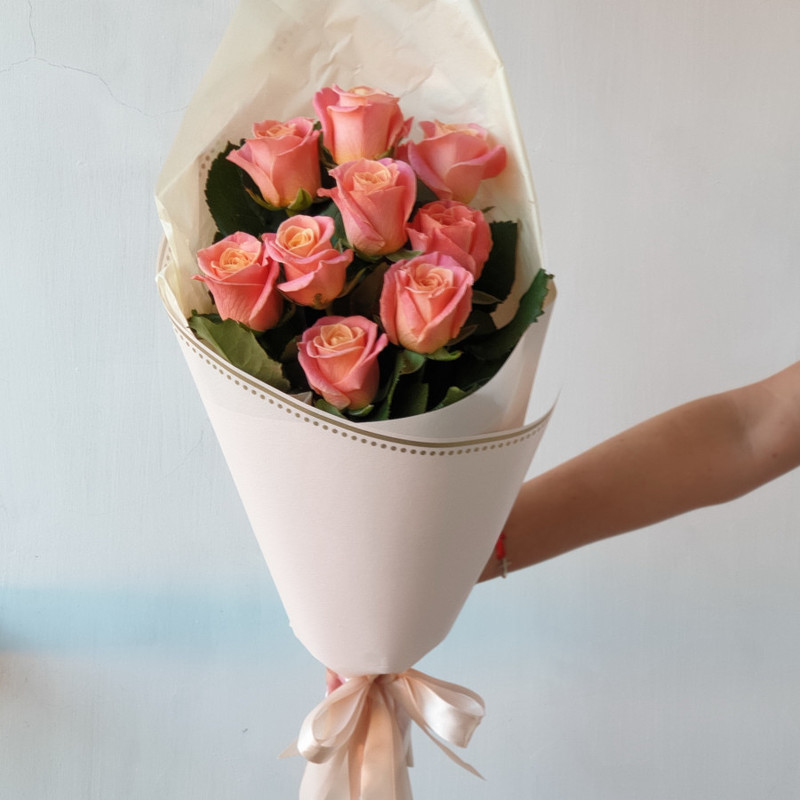 Bouquet of 9 coral roses in a package, standart