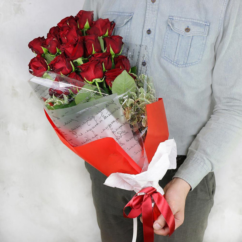 Bouquet of 19 red roses and pittosporum in a bright package, standart