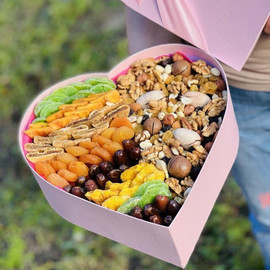 Set of nuts and dried fruits in a heart box