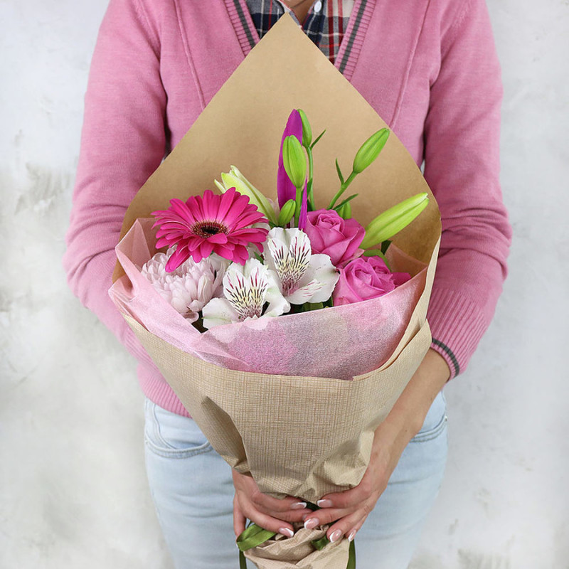 Bouquet of gerbera lilies and roses in craft, standart