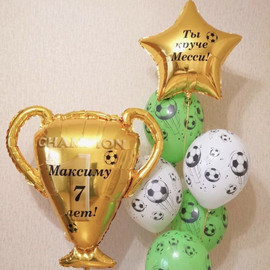 Set of soccer balls with cup