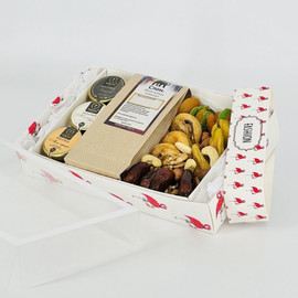 Gift set of dried fruits in a box with tea and honey