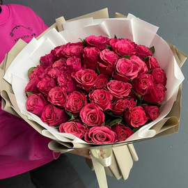 Fragrant crimson roses in stylish packaging