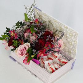 Gift box with flowers and sweets