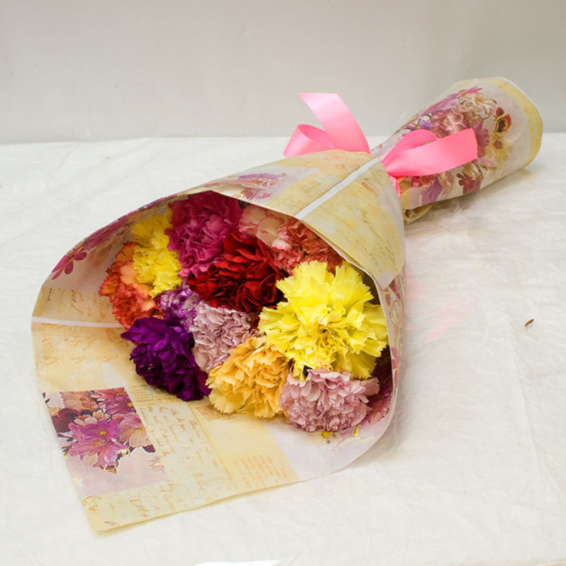 Bouquet of multi-colored carnations in craft, standart