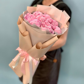 Bouquet of delicate peonies in a stylish package
