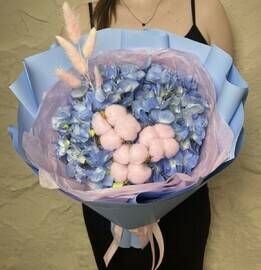 Bouquet of blue hydrangea with cotton and lagurus