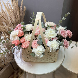 Stylish basket with delicate flowers 