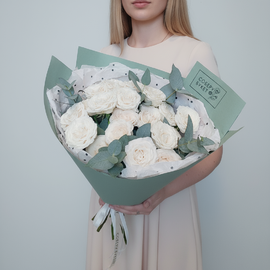 Bouquet of cream bush roses with eucalyptus