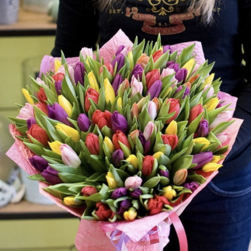 Bright and fragrant bouquet of 101 tulips in the design, standart