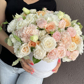Box with flowers: hydrangea, roses, dianthus, eustoma, bush roses