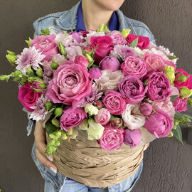 Basket with berry flowers, peony-shaped roses, eustoma