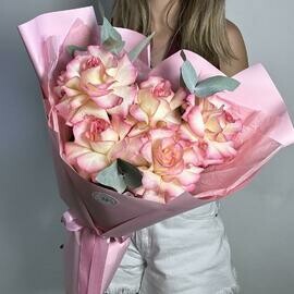 Inverted roses and eucalyptus in a pink package