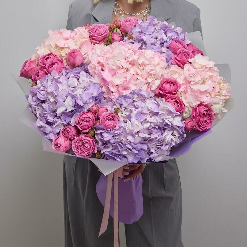 A bright bouquet of peony-shaped roses and hydrangeas, standart