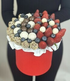 Box of chocolates with strawberries and blueberries 