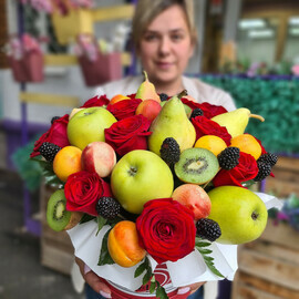 A composition of fruits and roses