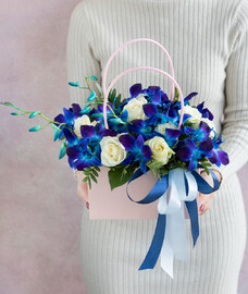 Bag made of blue dendrobium and white roses