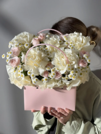 Composition with inverted roses and thanacetum