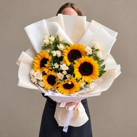 Sunflowers and bush roses 