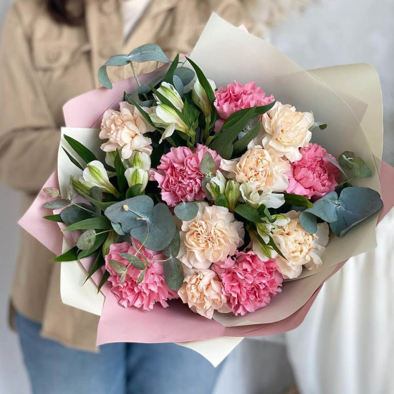 Round bouquet of delicate carnations with alstroemeria Moore, standart