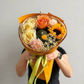 Bouquet with sunflower, daisies, peony-shaped roses and pumpkin